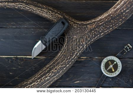 Knife And Compass On A Black Background.