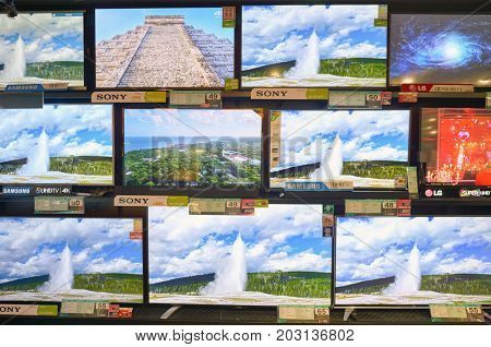 HONG KONG - NOVEMBER 02, 2015: TVs on display at electronics store in New Town Plaza. New Town Plaza is a shopping mall in the town centre of Sha Tin in Hong Kong.