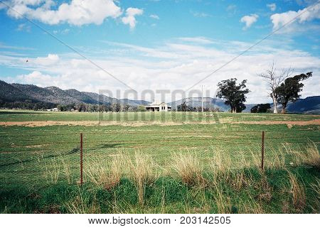 Old abandoned farm house in Australian paddock.