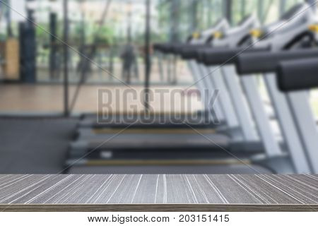 fitness facility center gym interior health club with sports training equipment for aerobic exercise workout and bodybuilding blurry defocused background