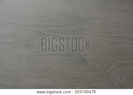 A Gray Floor Tile With Wooden Structure .