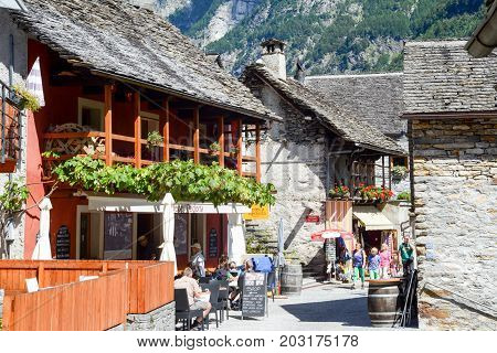 Sonogno Switzerland: 1 September 2014: Tourists visiting the rural village of Sonogno on Verzasca valley on the italian part of Switzerland