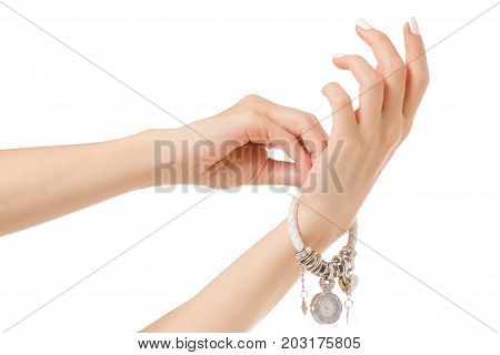 Female hand watches bracelet on white background isolation