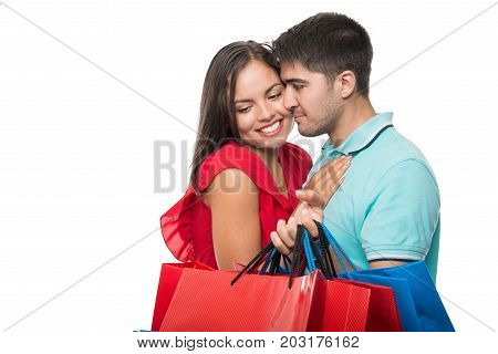 Boyfriend Offering Lots Of Shopping Bags To Girlfriend