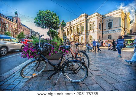 HELSINKI FINLAND: Bikes with view of downtown Helsinki in summer day near the Stockmann department store building on August 1 2013