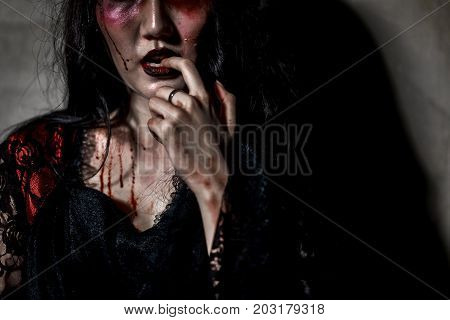 Zombie women death or witch the ghost drain hand blood skin is screaming darkness and nightmare horror of scary fear on hell is monster in halloween festival conceptcopy space the right.