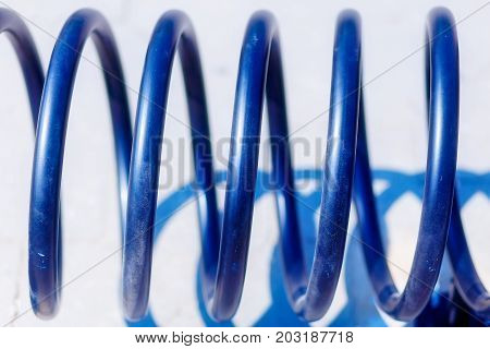 Metal spiral of empty bike stand. Blur background