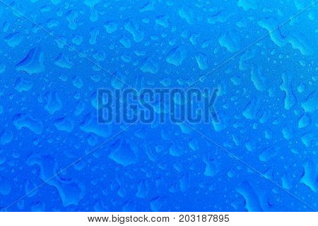Drops on the car. Blue metal color car