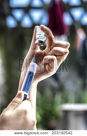 Nurse or doctor filling painkiller injection .