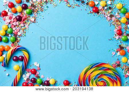Tasty appetizing Party Accessories Happy Birthday Sweet Treat Swirl Candy Lollypop Colorful Letters on Bright Background Top View Fashion Conceptual Holiday Flat Lay