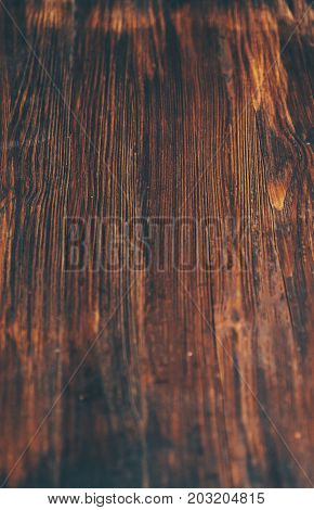 Dark vintage rustic wooden background with selective focus