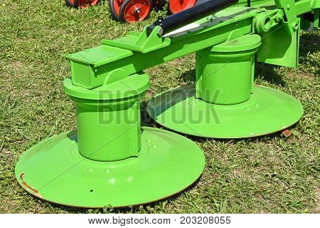 Agricultural machinery on the meadow in summer