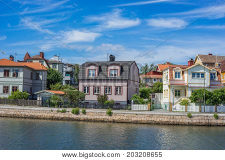 KARLSKRONA SWEDEN - 2017 July. Typical red Swedish wooden houses with natiaonal flag in the city of Karlskrona.