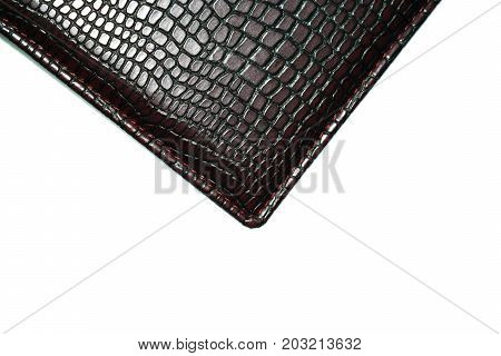 a piece of dark skin on a white background. Texture