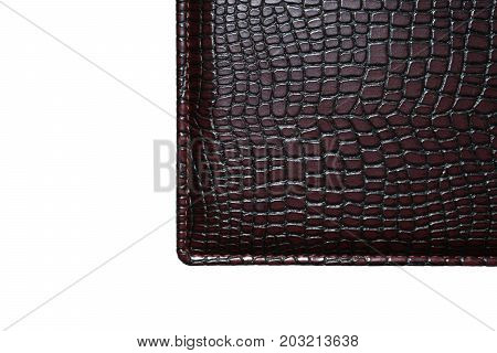 a piece of dark skin on a white background. Texture