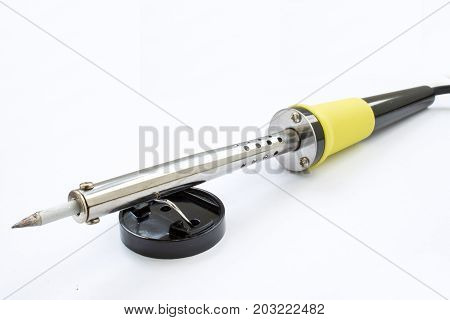 Soldering iron on white background. closeup shot