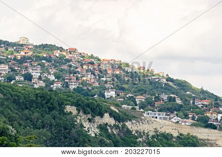 The Black Sea Shore, Green Hills With Houses, Blue Clouds Sky. City Balchik Coast
