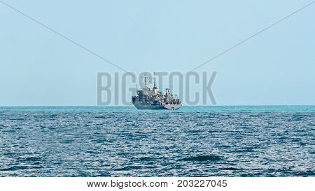 Boat Or Ship Navigating On Blue Black Sea Water, Cargoboat
