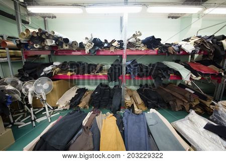 MOSCOW - FEB 21, 2017: Empty workshop with shelves with leather rolls in Ralf Ringer factory. Company production is 1,5 million pairs per year