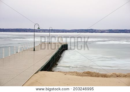 The dock in Wequetonsing, Michigan, during March, when ice still covers Little Traverse Bay.