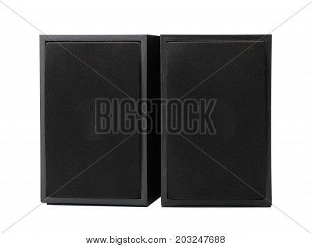 A close-up picture of a couple of black vintage loudspeakers isolated on a white background. Audio equipment for sound quality. Entertainment, technology, music concept.