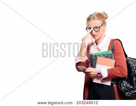 Young Student Girl Holding Books And Using Smart Phone..  Back To School