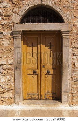 The door of the church. Fortress of the island of Spinalonga. Leprosarium. Crete, Greece. 