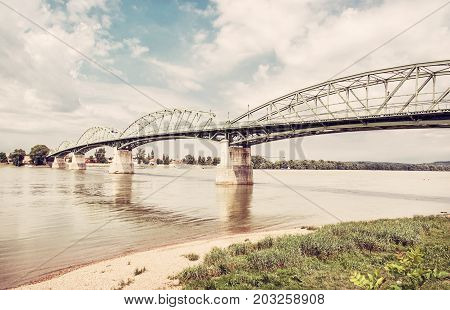 Maria Valeria bridge joins Esztergom in Hungary and Sturovo in Slovak republic across the Danube river. Transportation theme. Architectural scene. Retro photo filter.