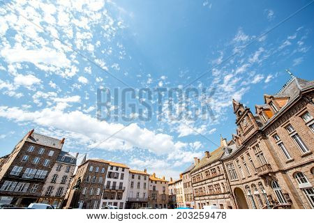 Old buildings in the central square of saint Flour town in Cantal region in France