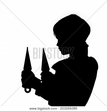 Black silhouette of little ninja holding throwing knives