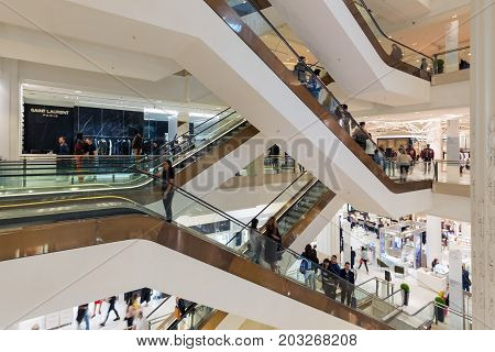 LONDON ENGLAND - JUNE 09 2017: Stairwell with shopping people in famous Selfridges department store London