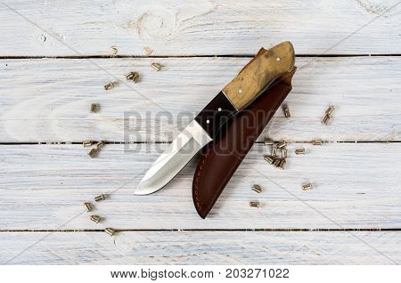 Outdoor Knife With A Brown Leather Case.
