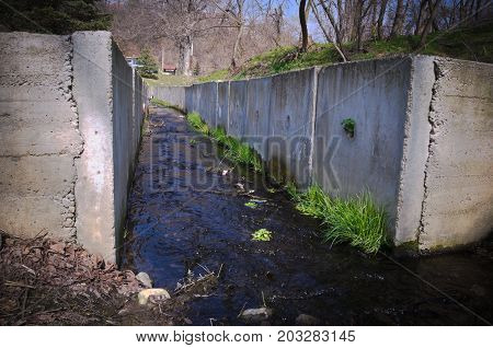 Water stream surrounded by concrete wall, Ledinci, Serbia
