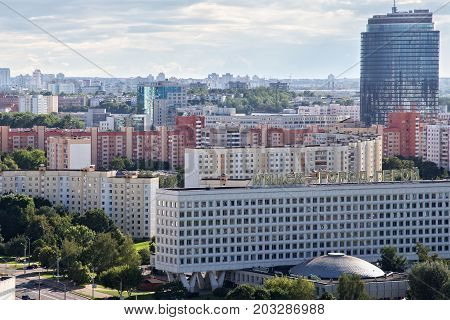 MINSK, BELARUS - AUGUST 15, 2016: Aerial view of the western part of the Minsk with high buildings. Minsk is the capital and largest city of Belarus. The inscription in Russian - 