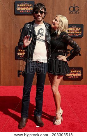 INGLEWOOD, CA - MAY 01: Singer Chris Janson (L) and wife Kelly Lynn attend the 2016 American Country Countdown Awards at The Forum on May 01, 2016 in Inglewood, California.