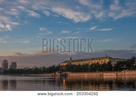YEKATERINBURG RUSSIA - 1 JULY 2017: Quay city pond Sevastyanov's house at sunset time/