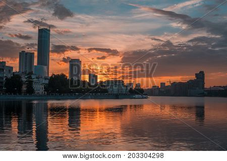 Yekaterinburg City Center On Sunset. City Pond View, Amazing Clouds And Sky. High Buildings, Skyscra