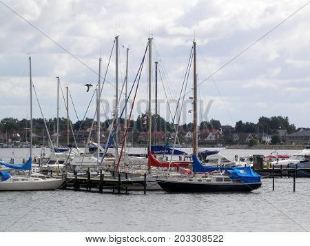 Graasten Denmark - August 22 2017: Boats tied up in small Baltic inlet on cloudy day