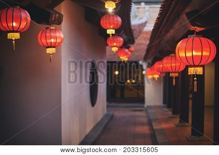 Vietnamese buddhist temple. Red lanterns and pagoda