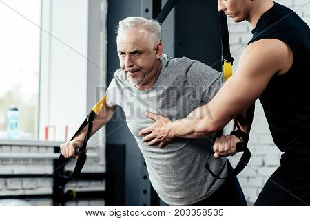Senior Sportsman Training With Trx