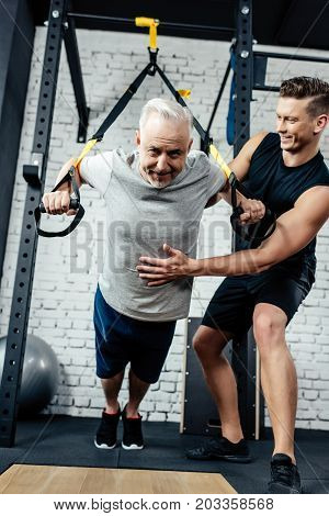 Senior Sportsman Training With Trx