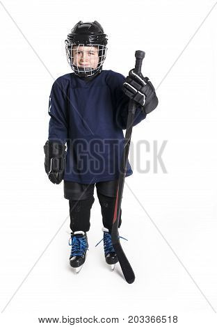 A Young boy in ice hockey gear against white