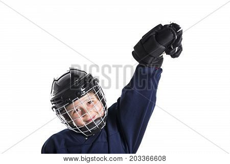 A Young boy in ice hockey gear against white