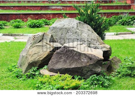 Large gray stones on the ground in the park