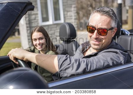 A Father On Car Journey With Teenage daughter