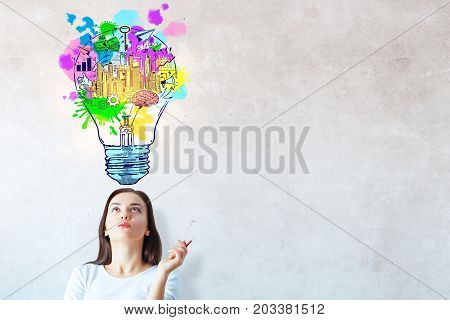 Portrait of attractive young european woman on concrete wall baclground with creative business sketch. Idea concept