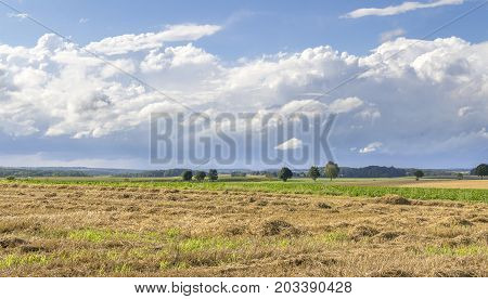 a clouded sky in rural agricultural ambiance