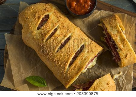 Homemade Cheesy And Meaty Italian Stromboli