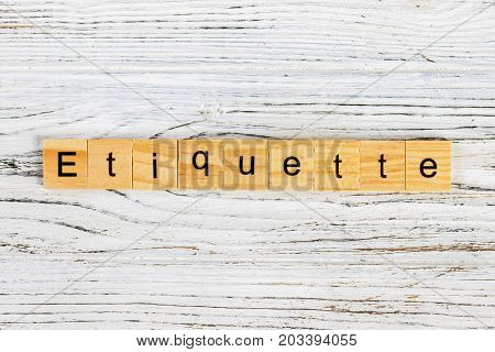 ETIQUETTE word made with wooden blocks concept