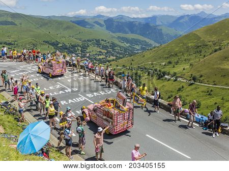 Col de PeyresourdeFrance- July 23 2014: Cochonou vehicle passing in the Publicity Caravn on the road to Col de Peyresourde in Pyrenees Mountains during the stage 17 of Le Tour de France 2014.